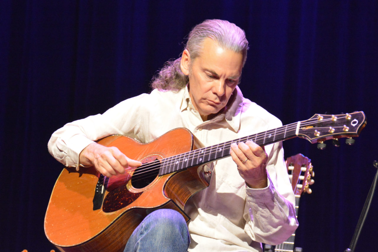 Dave Beegle to End Friday Winter Music Series at desk chair Workspace Jan 11