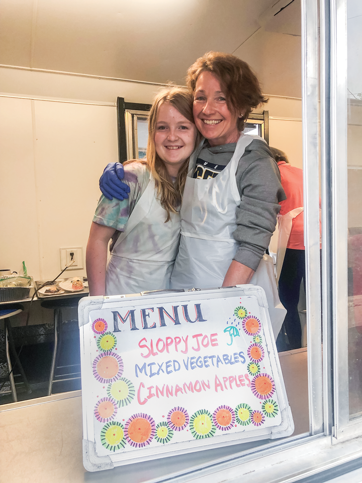 Ava Bentley and Mary Breckenridge volunteering at Loveland’s Community Kitchen. 