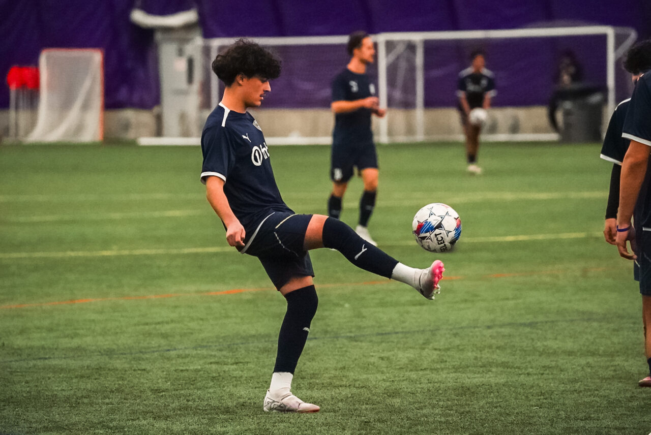 Evan Perez playing soccer. Photo by Blake Baker.