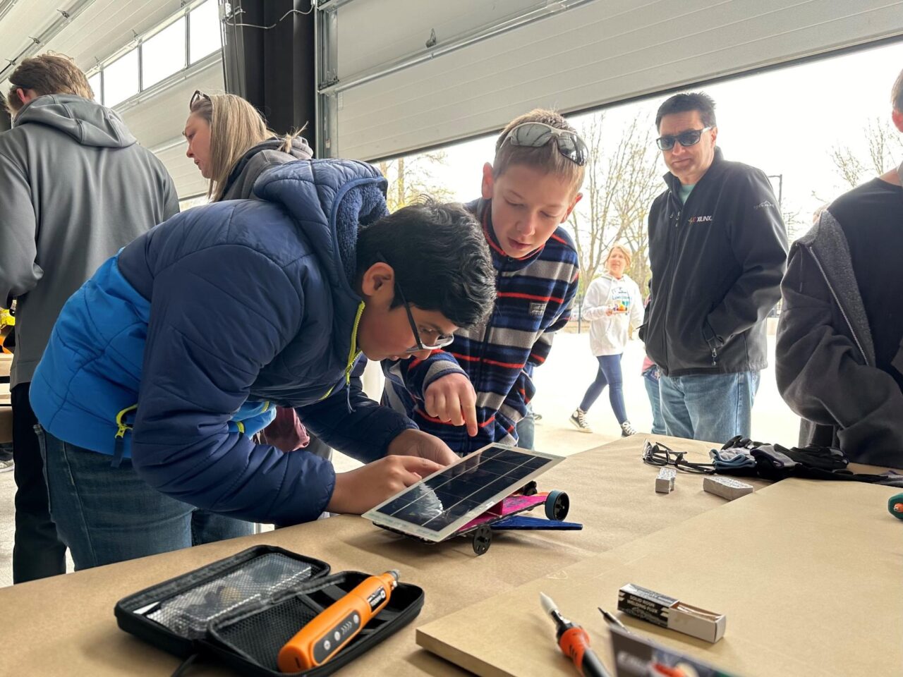 Competitors prepare to race battery- and solar-powered cars.