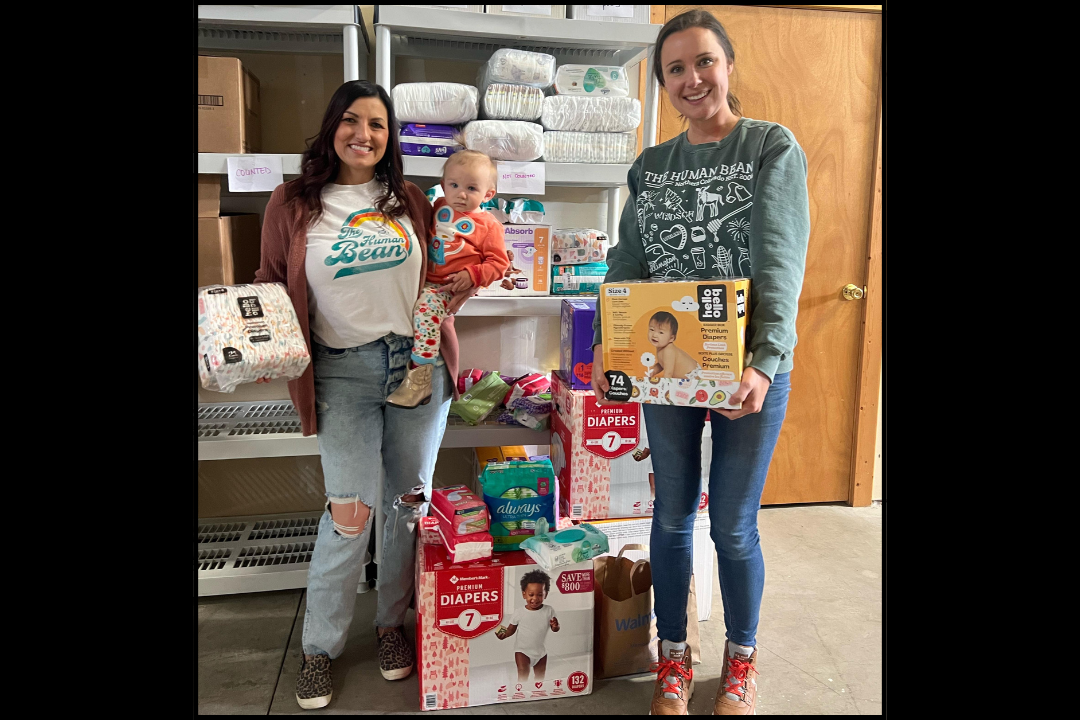 Human Bean Northern Colorado donates diapers, wipes and period products to Grace Upon Grace Project. Pictured from left to right: Krista Smith, Maisie and Val Katalenic.