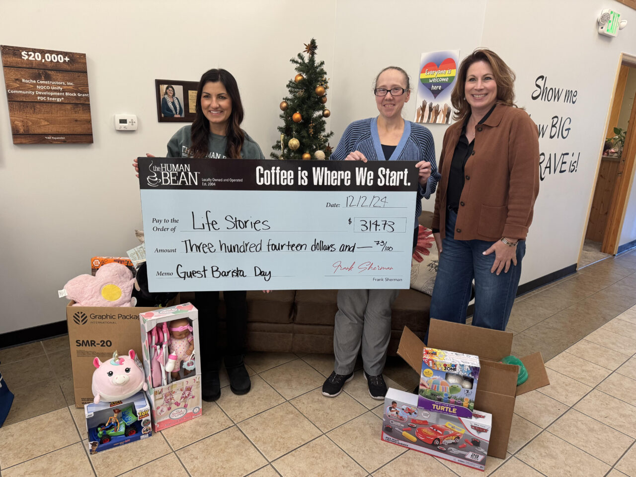 A check for $314.73, along with many boxes of toys, were presented to the Life Stories nonprofit. Pictured from left to right: Krista Smith, Brianna Fischer and Lisa Drake.